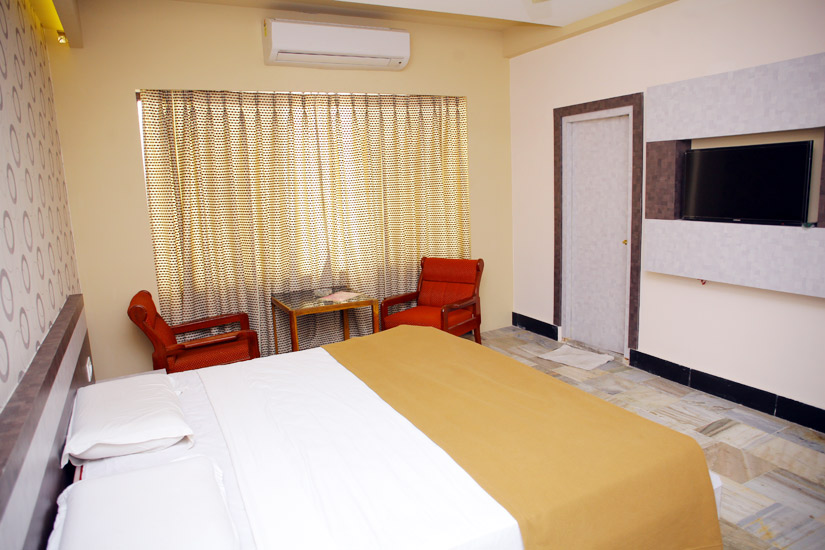 Bedroom with curtained window