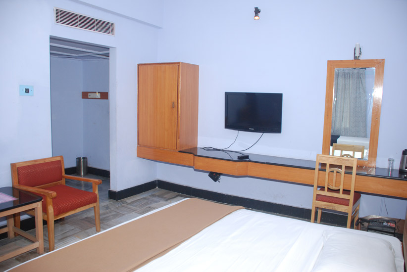 Bedroom with dressing mirror and wardrobe