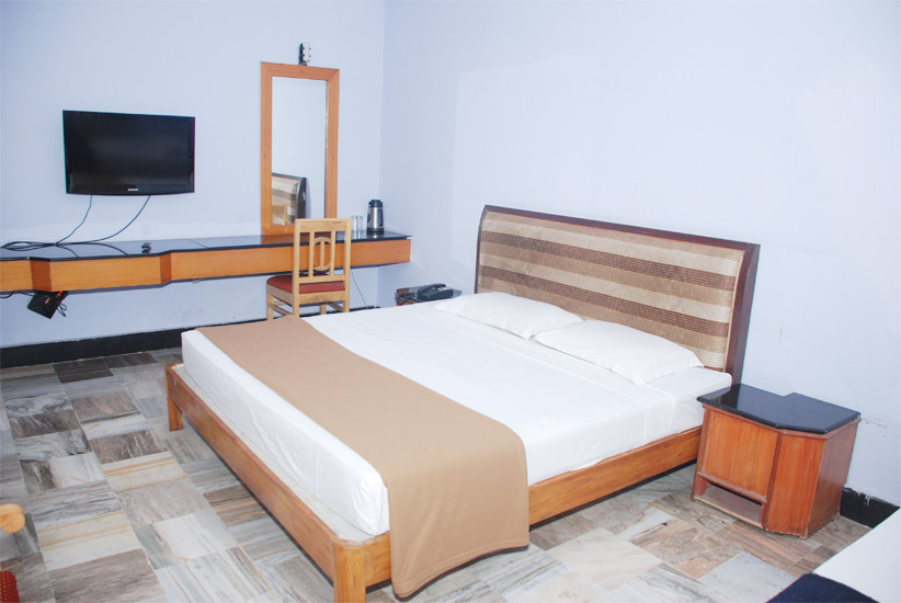 Bedroom with wall-mounted television